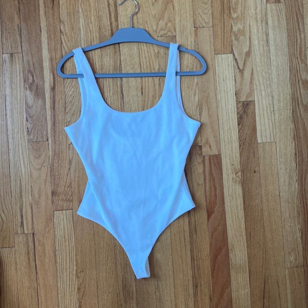 Lovers and Friends Medium scoop neck body suit. Minimal wear (pilling pictured)